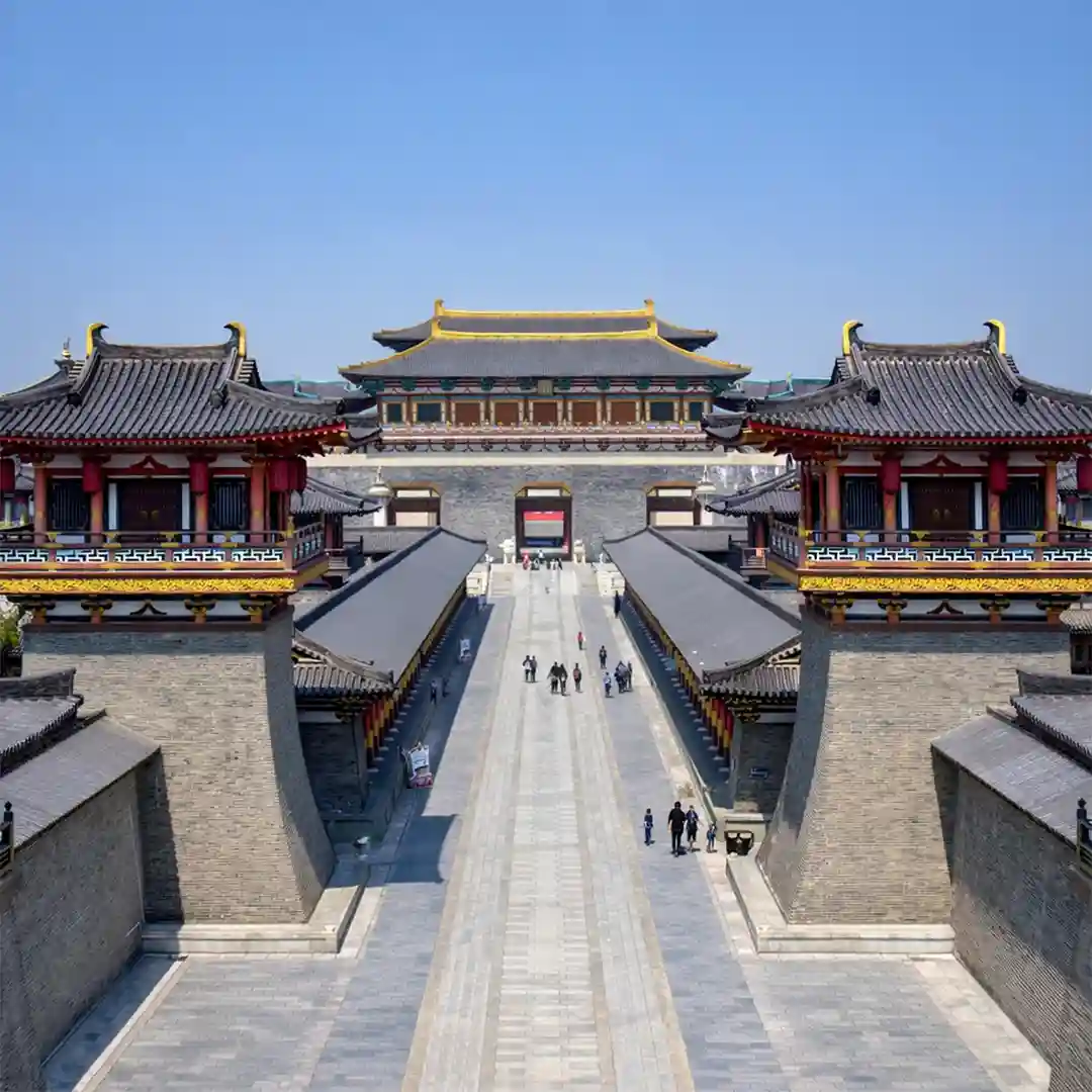Tang Dynasty Unceasing City Xi'an at night with illuminated streets, traditional buildings, and cultural performances