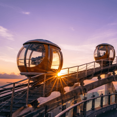 Visitors on the open-air Canton Tower Sky Walk observation deck overlooking Guangzhou skyline